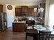 Well-equipped kitchen with stainless steel appliances, granite countertops, and an adjacent dining area for Gathering meals at 1291 Long Acre Dr, Loganville, GA 30052