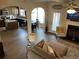 Open-concept living room flows to kitchen, with fireplace, tv, cozy seating, and stylish decor at 1291 Long Acre Dr, Loganville, GA 30052