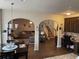 Open living area with comfortable seating, stairs and desk, seamlessly connecting the kitchen at 1291 Long Acre Dr, Loganville, GA 30052