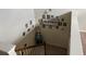Stairway adorned with a gallery wall of Gathering photos and 'Blessed' sign at 1291 Long Acre Dr, Loganville, GA 30052