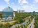 An aerial view of a building, neighborhood and train tracks during the day at 2707 Cumberland Se Ct, Smyrna, GA 30080