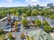 An aerial view of a shopping center and surrounding neighborhood during the day at 2707 Cumberland Se Ct, Smyrna, GA 30080