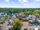 An aerial view of a shopping center and surrounding neighborhood during the day at 2707 Cumberland Se Ct, Smyrna, GA 30080