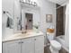 Well-lit bathroom with a vanity, tiled shower, and updated fixtures at 2707 Cumberland Se Ct, Smyrna, GA 30080