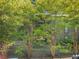 Townhome exterior surrounded by trees and greenery in a natural setting at 2707 Cumberland Se Ct, Smyrna, GA 30080