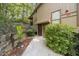 Inviting townhome entrance with wood trim, lush landscaping, and a private, cozy setting at 2707 Cumberland Se Ct, Smyrna, GA 30080