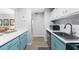 Stylish kitchen with blue cabinets, stainless steel appliances, and ample counter space at 2707 Cumberland Se Ct, Smyrna, GA 30080
