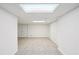 Finished basement with carpet, white walls, and bi-fold closet doors at 4787 Burford Nw Ct, Acworth, GA 30102