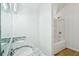 Bathroom featuring a double granite vanity, and a white tub and shower at 4787 Burford Nw Ct, Acworth, GA 30102