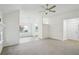 Inviting living space with neutral tones, vaulted ceiling, lots of light, and a view to the kitchen at 4787 Burford Nw Ct, Acworth, GA 30102