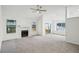 Bright living room with large windows, fireplace, ceiling fan and access to the outdoor deck at 4787 Burford Nw Ct, Acworth, GA 30102