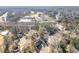Aerial view showcasing the property's location in a wooded neighborhood at 5659 Brookstone Nw Dr, Acworth, GA 30101