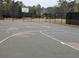 Well-maintained community basketball court enclosed by a fence, perfect for games and recreational activities at 5659 Brookstone Nw Dr, Acworth, GA 30101