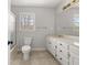 Bathroom with a tiled floor, white vanity, framed mirror and a shower at 5659 Brookstone Nw Dr, Acworth, GA 30101