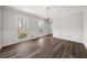 Dining room with fresh paint, hardwood floors, modern chandelier and lots of natural light at 5659 Brookstone Nw Dr, Acworth, GA 30101