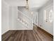 Inviting foyer with hardwood floors and staircase, freshly painted and ready to welcome guests at 5659 Brookstone Nw Dr, Acworth, GA 30101