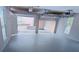Spacious garage with epoxy flooring and an automatic door opener at 5659 Brookstone Nw Dr, Acworth, GA 30101