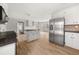 Bright eat-in kitchen featuring white cabinets, stainless steel appliances, and center island at 5659 Brookstone Nw Dr, Acworth, GA 30101
