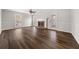 Cozy living room with fireplace, large windows, and new dark hardwood floors at 5659 Brookstone Nw Dr, Acworth, GA 30101