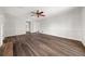 Spacious room with new dark hardwood floors, fresh paint and modern ceiling fan at 5659 Brookstone Nw Dr, Acworth, GA 30101