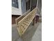 Newly constructed wood staircase and railing leading to screened porch boasts impeccable craftsmanship at 5659 Brookstone Nw Dr, Acworth, GA 30101