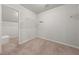 Spacious walk-in closet featuring carpeted floors and wire shelving at 5659 Brookstone Nw Dr, Acworth, GA 30101