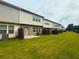 Townhome backyard with newly sodded lawn, privacy fences, and room for entertaining at 2059 Lanier Harbor Pt, Buford, GA 30518