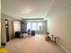 Spacious carpeted room with large windows for natural light at 2059 Lanier Harbor Pt, Buford, GA 30518