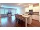 Open-concept kitchen with granite counters, stainless appliances, and a center island with seating at 2059 Lanier Harbor Pt, Buford, GA 30518