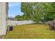 Backyard featuring an air conditioning unit, a white fence and grass at 3979 White Owl Nw Ct, Duluth, GA 30097