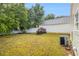Backyard featuring an air conditioning unit, a white fence and greenery at 3979 White Owl Nw Ct, Duluth, GA 30097