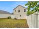 Spacious backyard featuring a well-maintained lawn and white fence for privacy at 3979 White Owl Nw Ct, Duluth, GA 30097