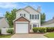 Charming two-story home featuring a brick-accented garage and manicured lawn at 3979 White Owl Nw Ct, Duluth, GA 30097