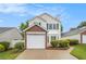 Charming two-story home featuring a brick-accented garage and manicured lawn at 3979 White Owl Nw Ct, Duluth, GA 30097