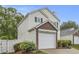 Home featuring a brick garage with well-maintained landscaping at 3979 White Owl Nw Ct, Duluth, GA 30097