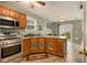 Eat-in kitchen with stainless steel appliances, granite countertops, and lots of natural light at 3979 White Owl Nw Ct, Duluth, GA 30097