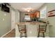 Bright kitchen featuring granite countertops, stainless steel appliances, and a breakfast bar with seating at 3979 White Owl Nw Ct, Duluth, GA 30097