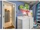 Laundry room featuring a washer and dryer, open doorway to the kitchen at 3979 White Owl Nw Ct, Duluth, GA 30097