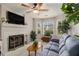 Cozy living room with a fireplace, bay windows, and plush seating at 3979 White Owl Nw Ct, Duluth, GA 30097