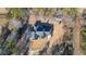 Aerial view of beautiful home with a pristine roof and lush, wooded surroundings at 6218 Old Stilesboro Nw Rd, Acworth, GA 30101