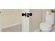 Bathroom with tile floor, toilet, and access to the walk-in closet at 6218 Old Stilesboro Nw Rd, Acworth, GA 30101