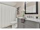 Bathroom featuring tub, decorative vanity with marble counter top and stylish mirror at 6218 Old Stilesboro Nw Rd, Acworth, GA 30101