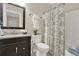 Bathroom featuring a dark wood vanity, neutral walls, and shower with curtain at 6218 Old Stilesboro Nw Rd, Acworth, GA 30101