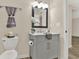 Bathroom featuring decorative gray vanity with marble counter top and stylish mirror at 6218 Old Stilesboro Nw Rd, Acworth, GA 30101