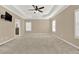Large primary bedroom offers natural light, neutral paint, and cozy carpet with plenty of space at 6218 Old Stilesboro Nw Rd, Acworth, GA 30101