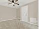 This bedroom features neutral walls, carpet flooring, and a ceiling fan for comfortable living at 6218 Old Stilesboro Nw Rd, Acworth, GA 30101
