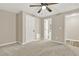 Bright bedroom featuring carpet floors, neutral walls and ensuite bathroom access at 6218 Old Stilesboro Nw Rd, Acworth, GA 30101