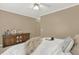 Neutral bedroom featuring a ceiling fan, plush bedding and carpet at 6218 Old Stilesboro Nw Rd, Acworth, GA 30101