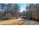 Long, private driveway leading to a secluded home, providing both elegance and ample parking space at 6218 Old Stilesboro Nw Rd, Acworth, GA 30101
