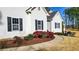 Attractive home with beautiful landscaping, a walkway and manicured lawn, enhancing the property's curb appeal at 6218 Old Stilesboro Nw Rd, Acworth, GA 30101